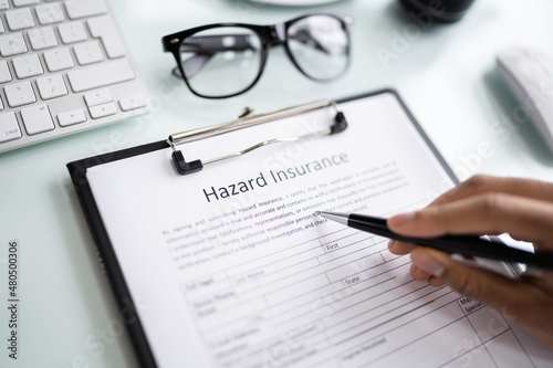 Man Filling Hazard Insurance Form