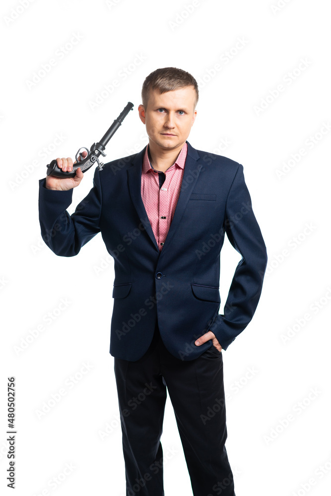 man in a blue business suit with a gun. builder, engineer, foreman, boss, rukuvatel, businessman. man hits the target. successful, armed man. isolated man in a blue business suit with a gun. builder, engineer, foreman, boss, rukuvatel, businessman. man hits the target. successful, armed man. isolated