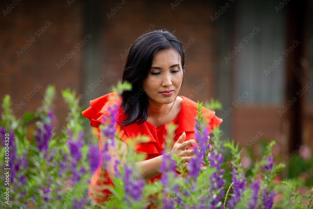 beautiful woman with red shirt taking care the flower beautiful woman with red shirt taking care the flower