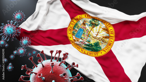 Florida and covid pandemic - virus attacking a state flag of Florida as a symbol of a fight and struggle with the virus pandemic in this state, 3d illustration photo