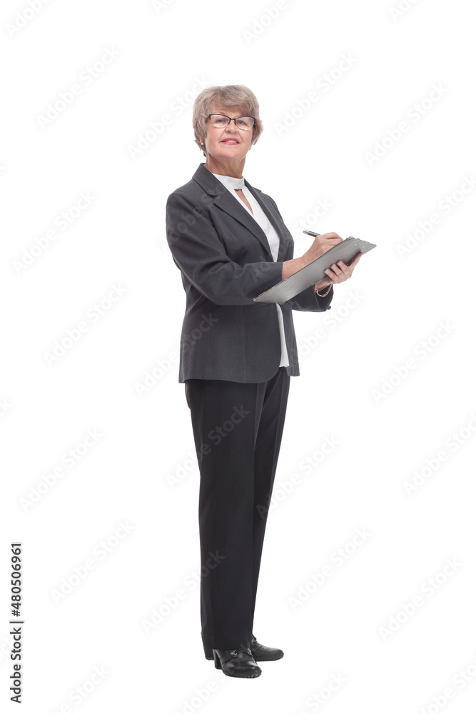 Side view of senior stylish businesswoman writing on clipboard Side view of senior stylish businesswoman writing on clipboard