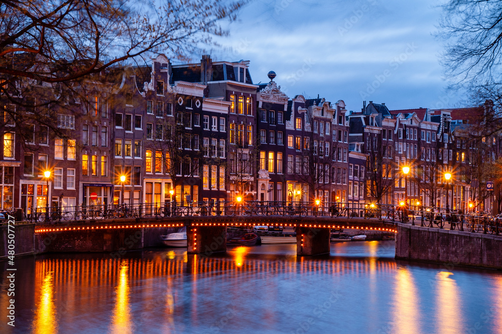 Amsterdam, Netherlands, with illuminated bridge at night