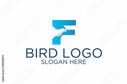 bird design logo and initial letter f. premium vector
