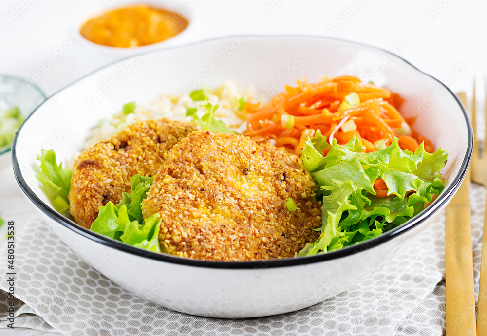 Orzo pasta, carrots and chicken burgers in white bowl. Risoni pasta. Lunch. Orzo pasta, carrots and chicken burgers in white bowl. Risoni pasta. Lunch.
