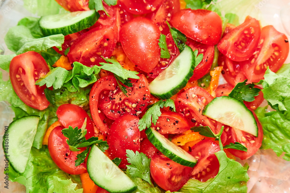 Bright, fresh vegetable salad. Cucumbers and tomatoes Bright, fresh vegetable salad. Cucumbers and tomatoes