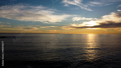 Fototapeta Naklejka Na Ścianę i Meble -  Golden sunset over the ocean taken from Clifton Fourth Beach, Cape Town, South Africa