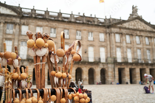 Pilgrim sticks for sale in the street in front of the Santiago' Cathedral. Symbols used on the Jacobean route since the Middle Ages. photo