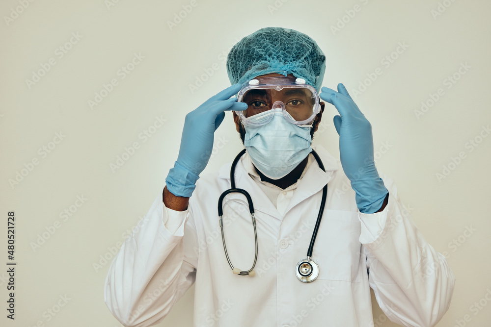 Male Doctor Adjusting Protective Eyewear