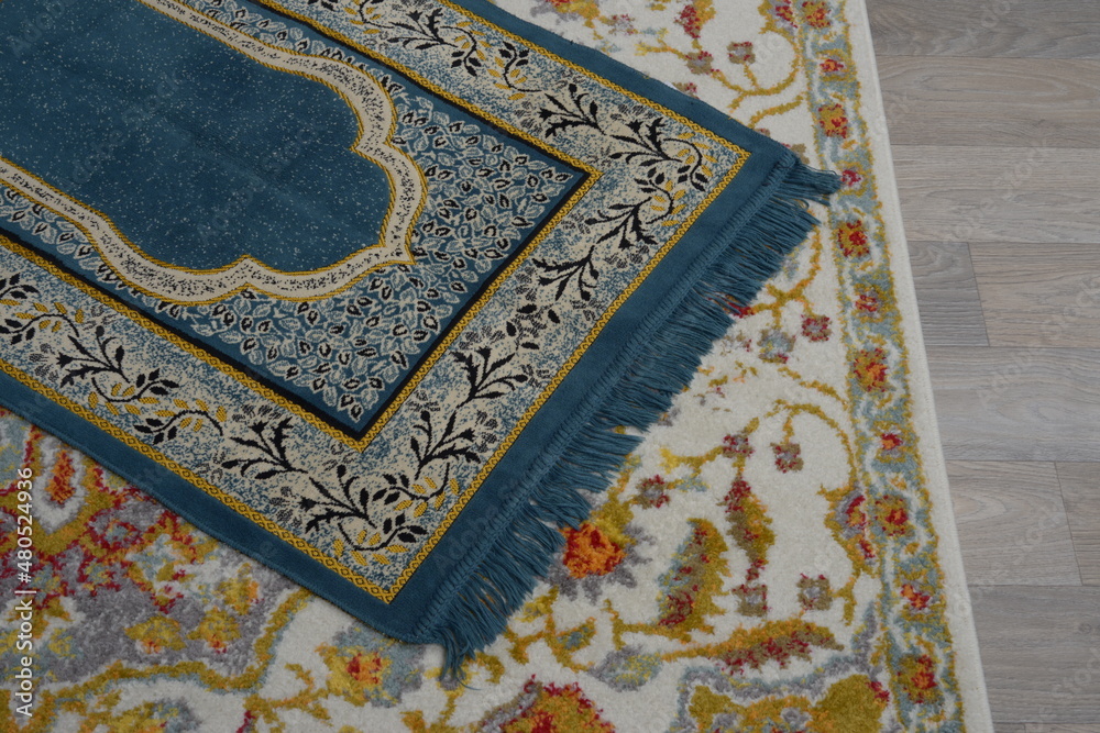 Prayer rug, small carpet used by Muslims to pray. Prayer rug, small carpet used by Muslims to pray.