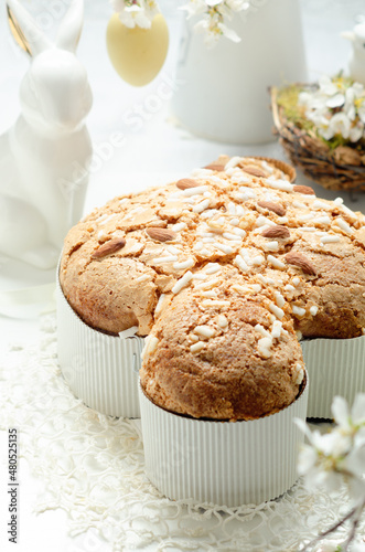 Colomba - italian festive easter dove cake on white rustic background. Selective focus.