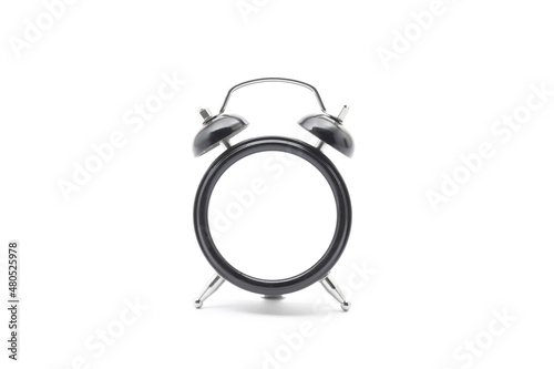 Empty black classic desk clock without dial on isolated white background with shadow. 