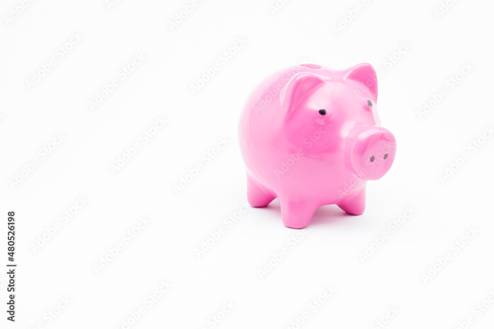Pink piggy bank on isolated white background.