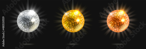 Foto Bright glowing disco balls set isolated on black background