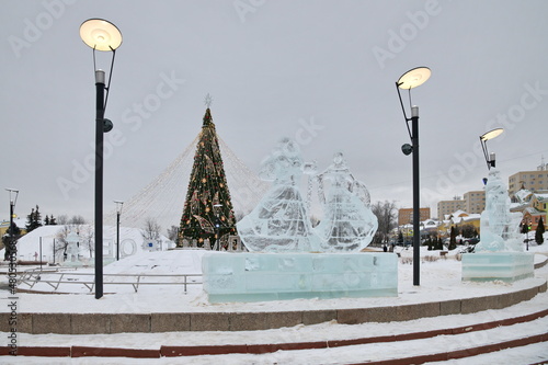 Dmitrov, Russia - January 13, 2022: Ice figures and a Christmas tree on Sovetskaya Square