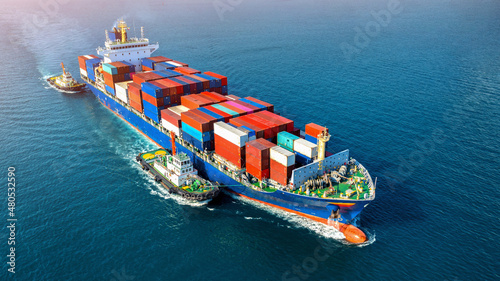 Aerial view of cargo ship with cargo container on sea.