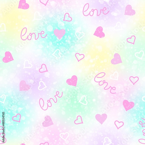 Delicate seamless abstract pattern of little pink hearts and inscription love on a light background of blurred color spots.
