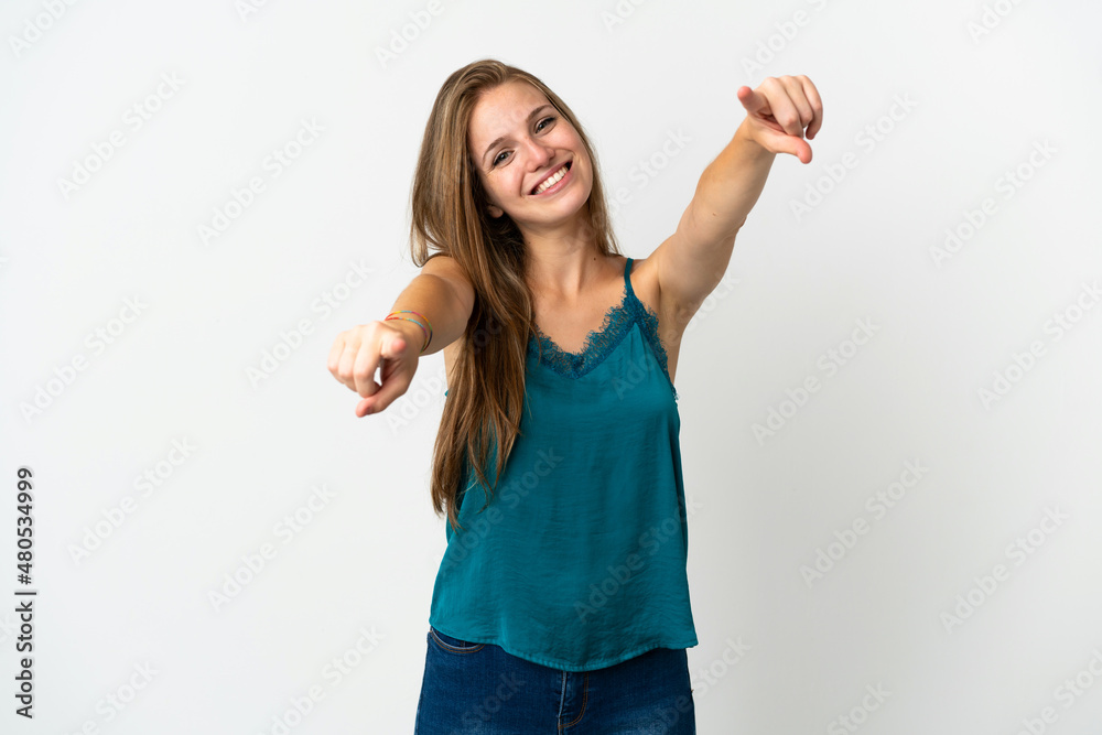 Young caucasian woman over isolated background pointing front with happy expression Young caucasian woman over isolated background pointing front with happy expression
