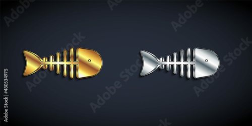 Gold and silver Fish skeleton icon isolated on black background. Fish bone sign. Long shadow style. Vector