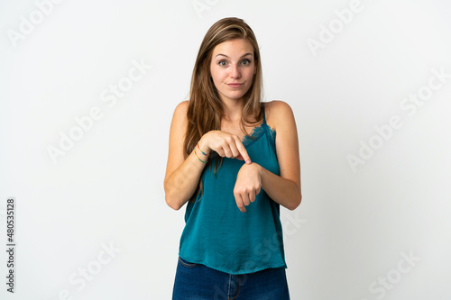 Young caucasian woman over isolated background making the gesture of being late