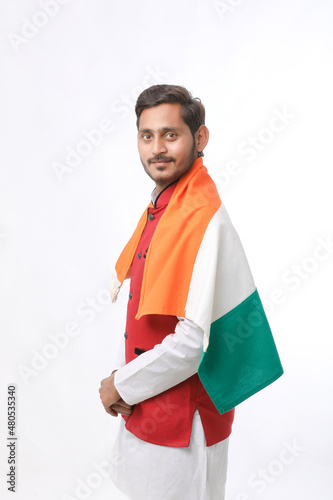 Young indian man with indian flag on white background.