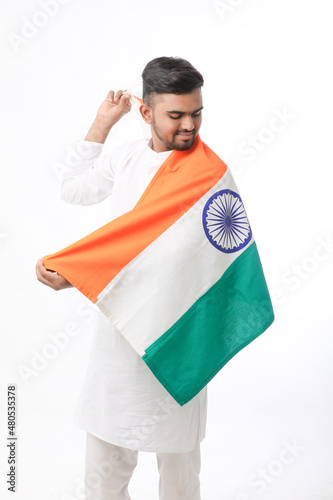 Young indian man with indian flag on white background.