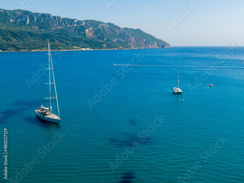 boats in Agios Georgios beach in north corfu island greece