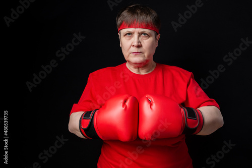 Granny boxer in red on a black background. © Zuev Ali