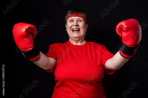 Granny boxer in red on a black background. © Zuev Ali