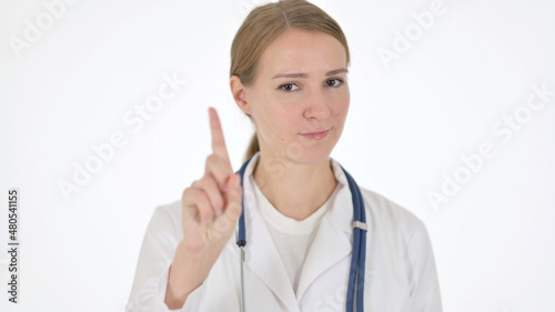 Female Doctor showing No Sign by Finger on White Background
