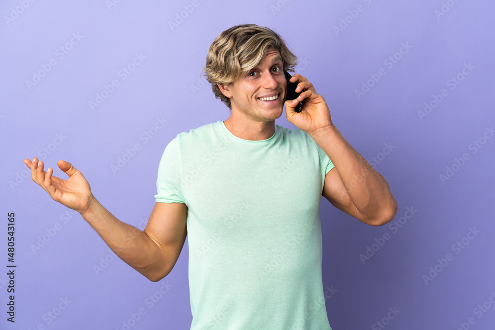 English man over isolated purple background keeping a conversation with the mobile phone with someone English man over isolated purple background keeping a conversation with the mobile phone with someone