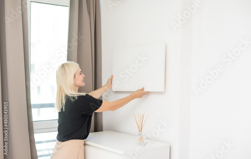 woman holding a blank board for your text