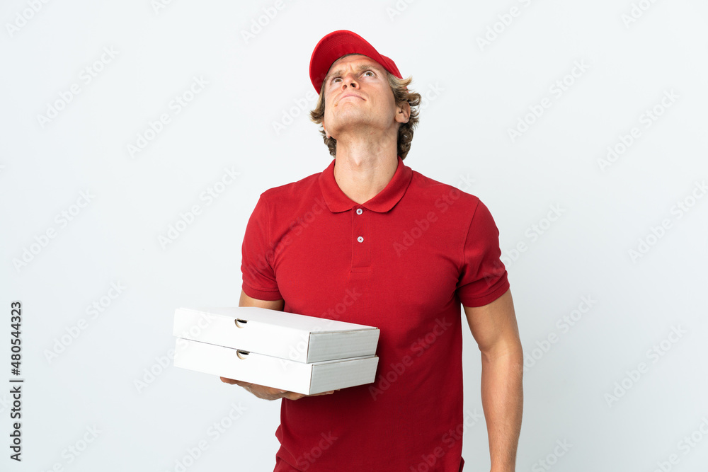 pizza delivery man over isolated white background and looking up pizza delivery man over isolated white background and looking up