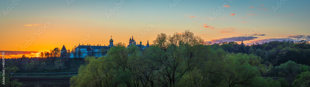 Beautiful wide angle panorama of Savvino-Storozhevskiy Monastyr' (Convent) with gradient sky at autumn sunset