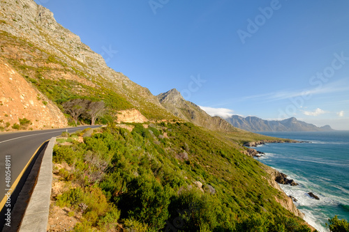 Beautiful coastal view of False bay and the Hottentots Holland mountains along the Clarence drive between Gordons Bay and Rooiels in the western cape, near Capetown in South Africa photo
