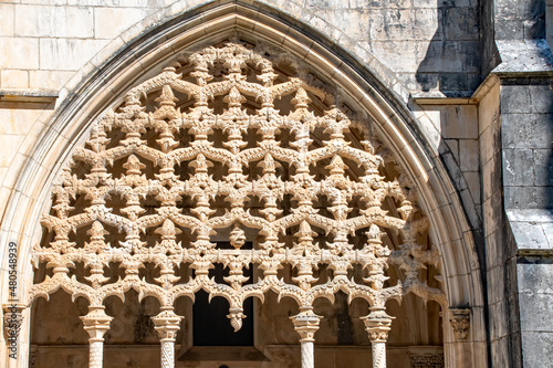 Filigree work of the stonemasons tracery. Window in the Mosteiro da Batalha Monastery - Dominican monastery in the Portuguese city of Batalha. Portugal photo