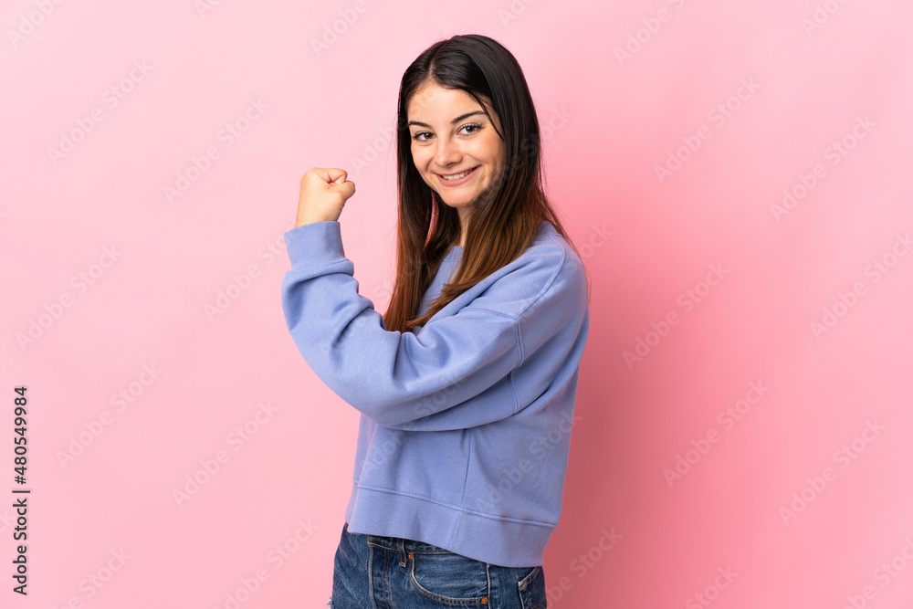 Young caucasian woman isolated on pink background celebrating a victory Young caucasian woman isolated on pink background celebrating a victory