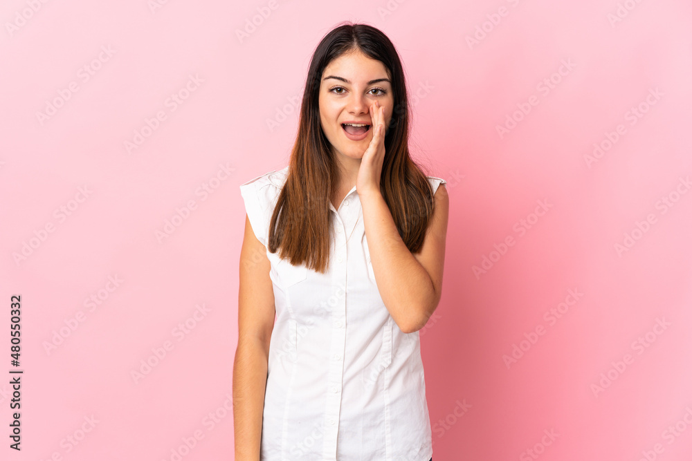 Fototapeta premium Young caucasian woman isolated on pink background shouting with mouth wide open