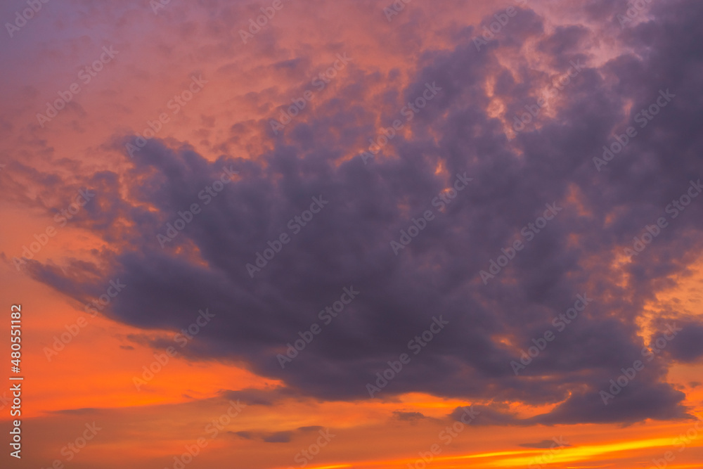 Orange sky with violet clouds at October's sunset
