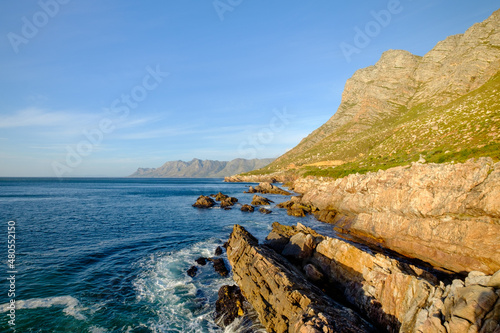 Beautiful coastal view of False bay and the Hottentots Holland mountains along the Clarence drive between Gordons Bay and Rooiels in the western cape, near Capetown in South Africa photo