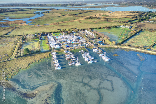 Thornham Marina and Prinstead Estuary Channel on the Southern Coast of England in the West Sussex countryside,, Aerial view.