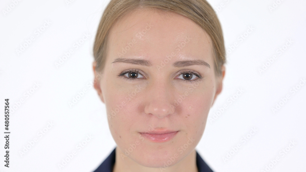Face Close Up of Serious Young Businesswoman Looking at Camera Face Close Up of Serious Young Businesswoman Looking at Camera