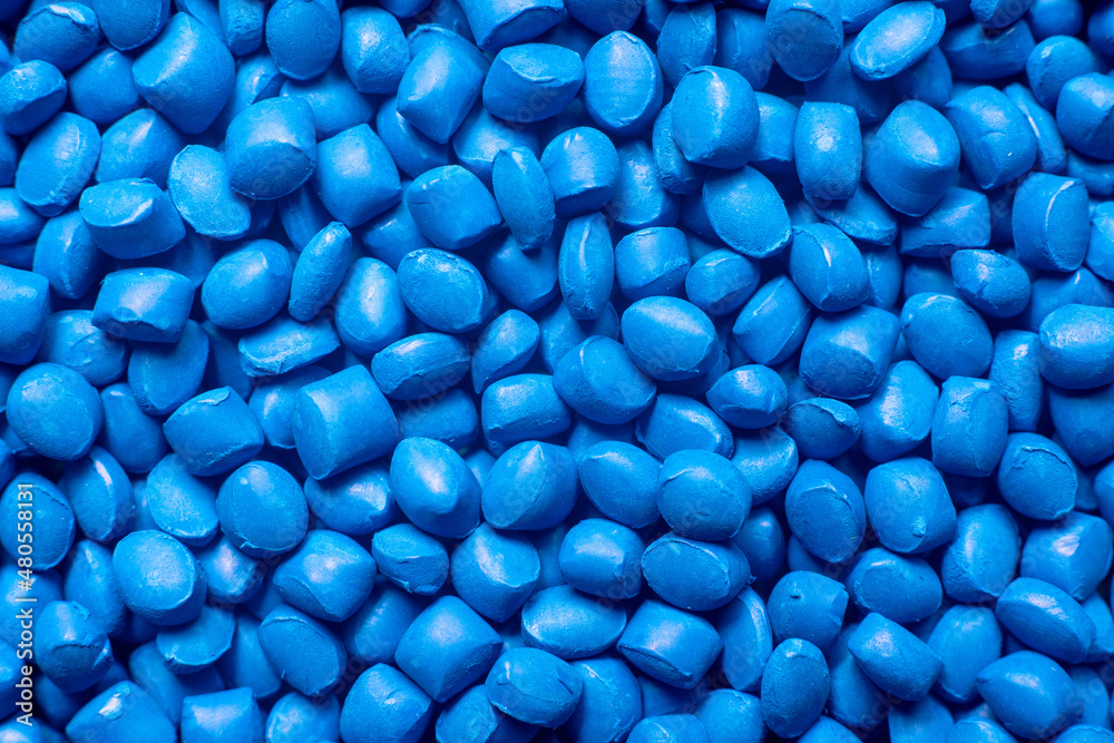 Blue polymer dye in granules, background texture Blue polymer dye in granules, background texture