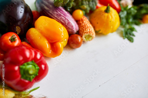 Top view assorted fresh organic vegetables on table in the kitchen in sunlight, grocery healthy shopping, vegan foodб flat lay, copy space. Layout with free text