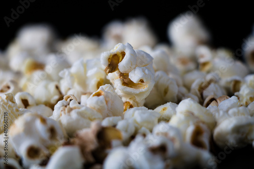 Close up of popcorn isolated on black background