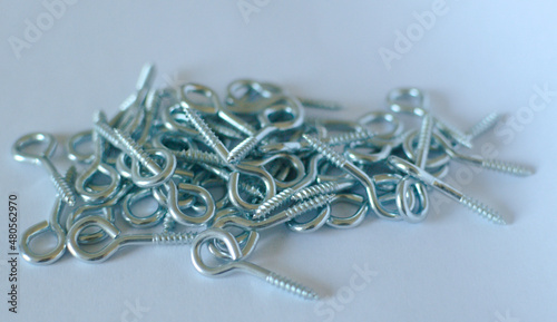 Metal hooks pins on a white background