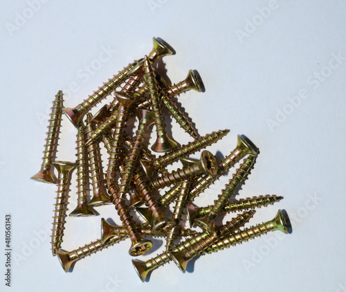 golden screws on a white background