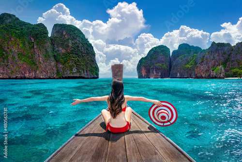 Beautiful girl in red bikini on boat at Koh Phi phi island, Thailand фототапет