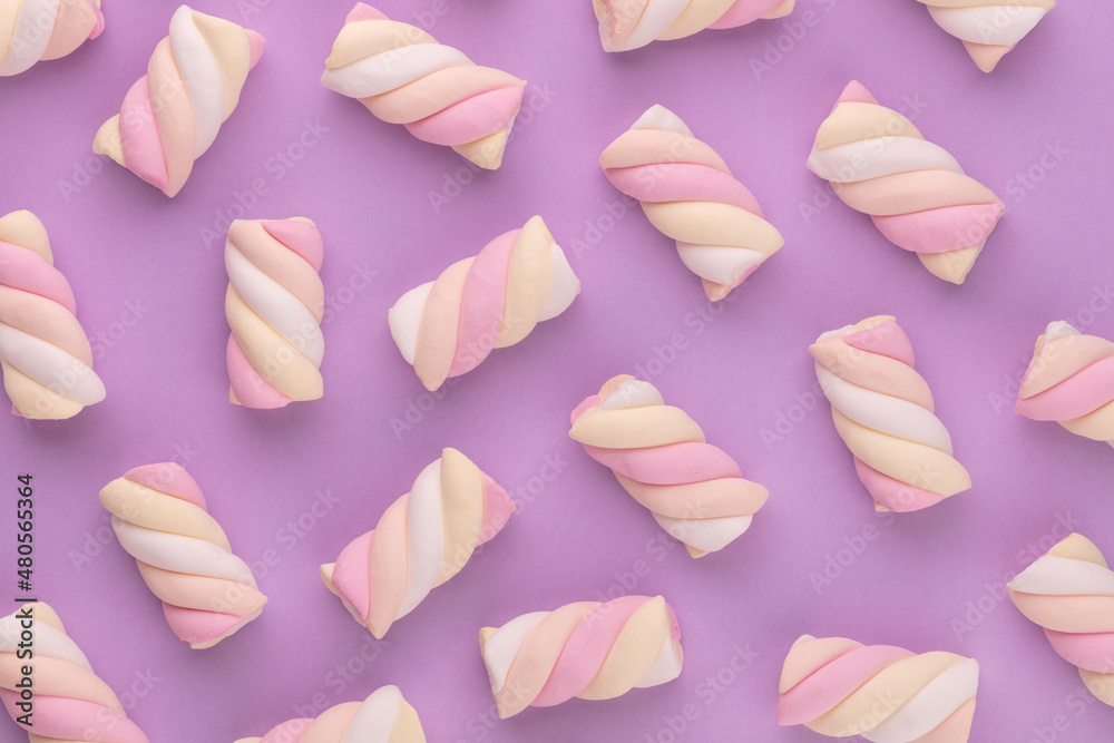 Colorful marshmallow laid out on pastel background. Creative textured pattern. Colorful marshmallow laid out on pastel background. Creative textured pattern.