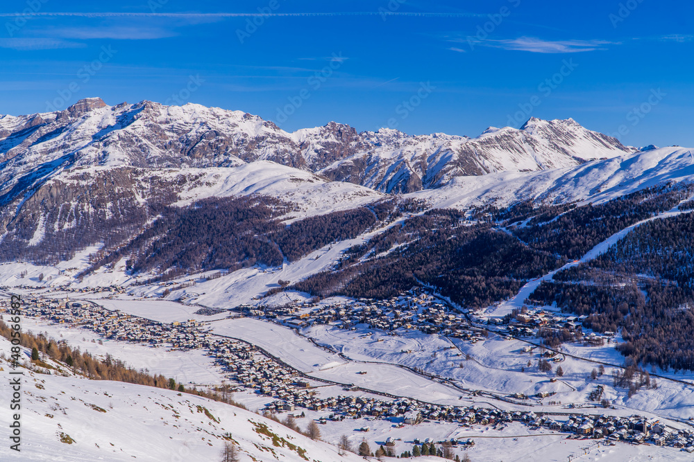 Panoramic view of the Italian Alps with the ski resort town of Livigno seen from the slopes in Livigno