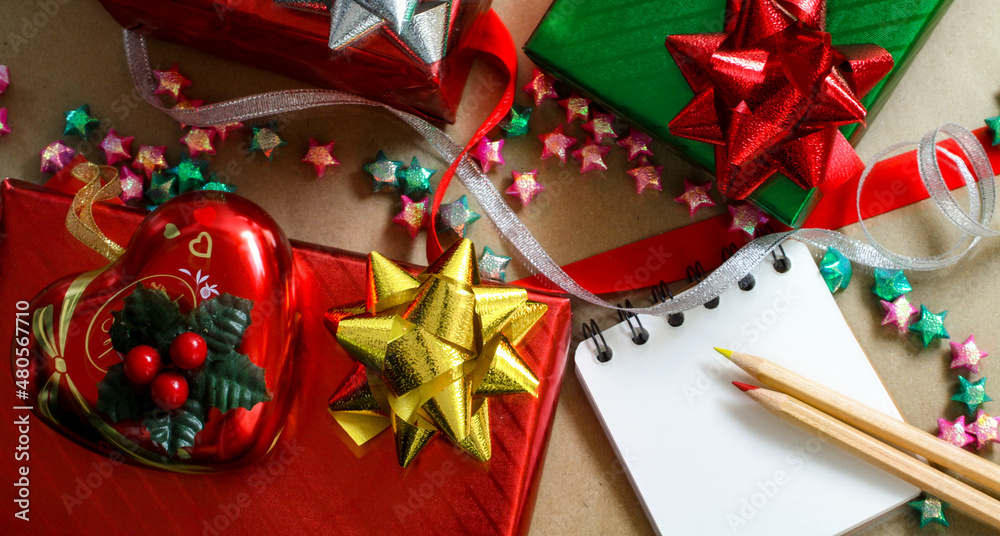 Red and green christmas gift boxes on brown background Red and green christmas gift boxes on brown background
